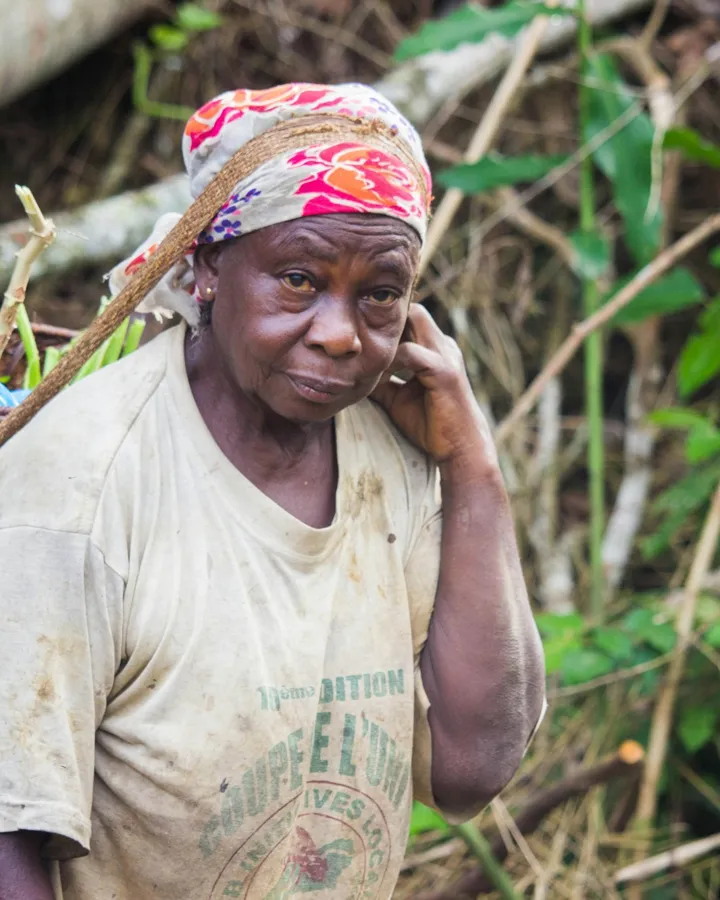 A farmer takes a call in her field.